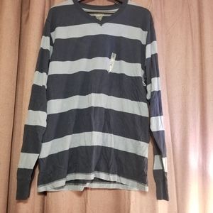 A dark blue and light blue striped long sleeve